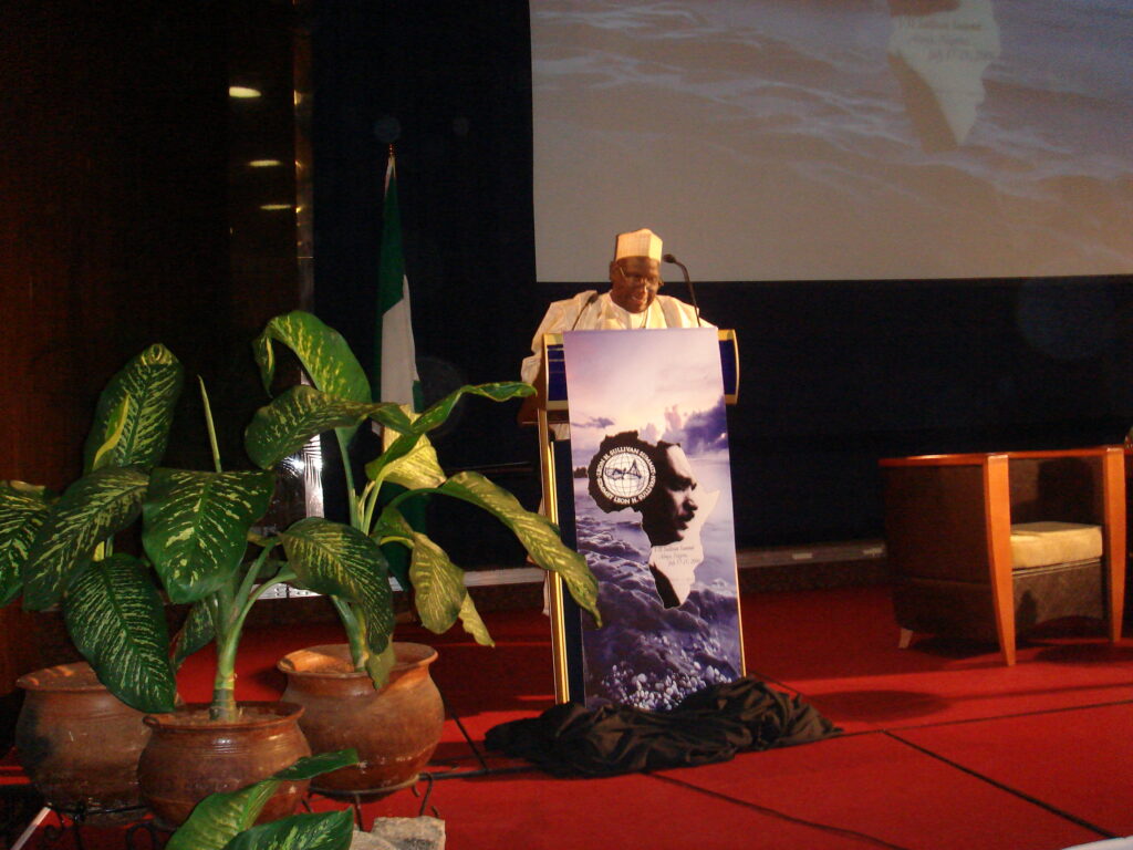 dr. tukur addressing a conference
